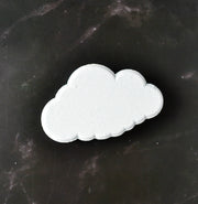 cloud shaped bath bomb on black marbled background